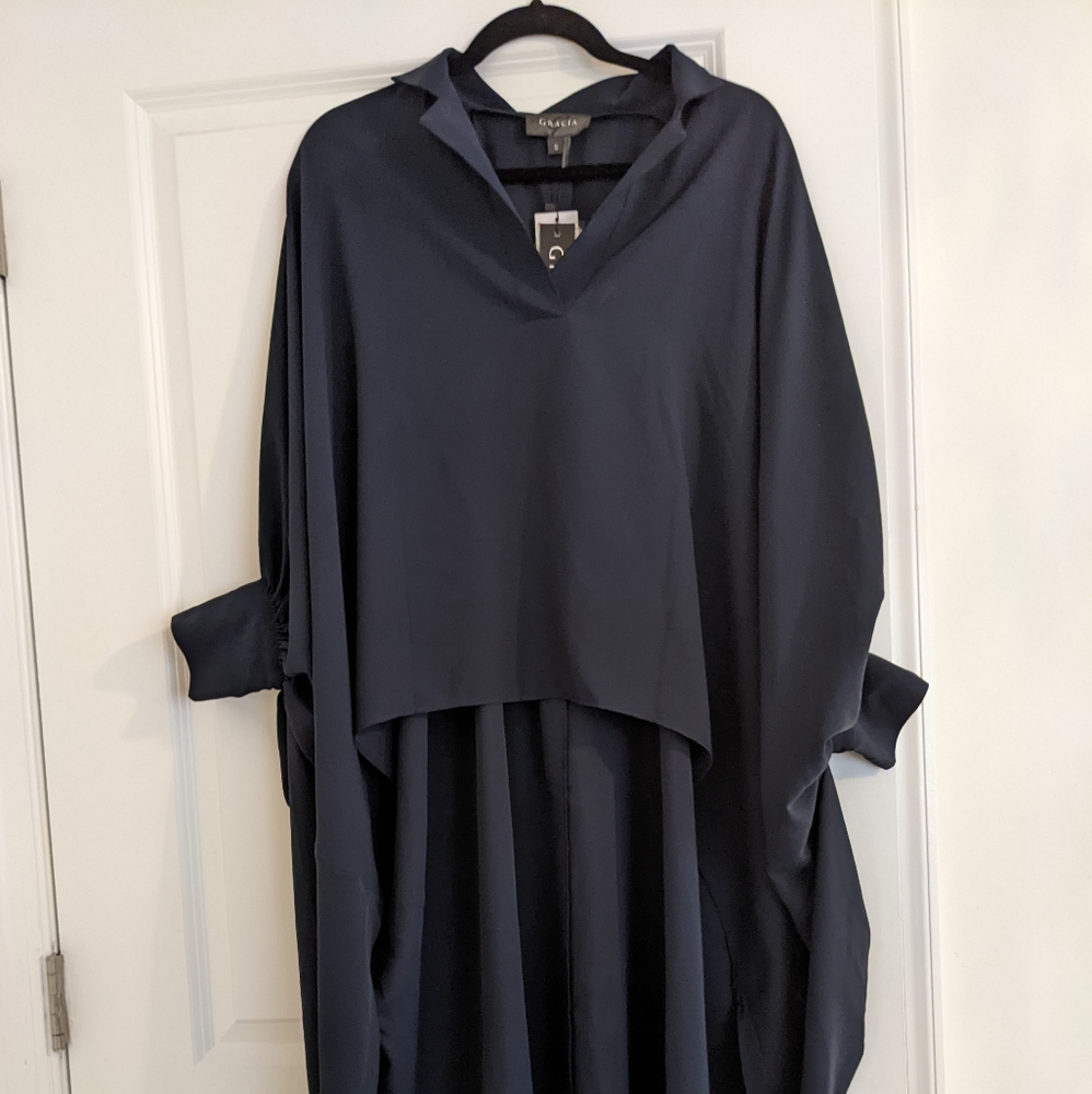 Brand new navy cape shirt says small but runs big